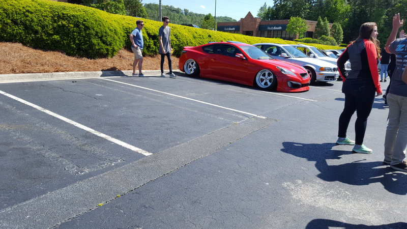 This car is bagged. Also the guy in the grey who looks like a vampire is the owner.